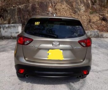 Mazda CX 5 AT 2WD  2014 - Cần bán lại xe Mazda CX 5 AT 2WD năm 2014, màu ghi vàng 