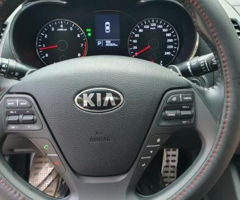 Kia K3 1.6 AT  2013 - Bán Kia K3 1.6 AT số tự động model 2014, Sx 2013, màu vàng 1 đời chủ mới 90%