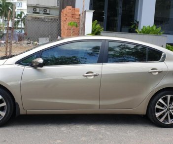 Kia K3 1.6 AT  2013 - Bán Kia K3 1.6 AT số tự động model 2014, Sx 2013, màu vàng 1 đời chủ mới 90%