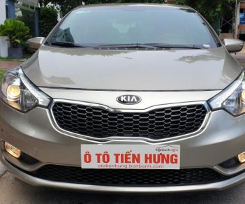 Kia K3 1.6 AT  2013 - Bán Kia K3 1.6 AT số tự động model 2014, Sx 2013, màu vàng 1 đời chủ mới 90%