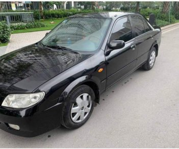 Mazda 323   2004 - Cần bán xe Mazda 323 đời 2004, màu đen, xe gia đình