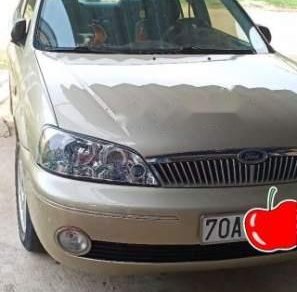 Ford Laser   2003 - Bán xe Ford Laser đời 2003, màu vàng, xe gia đình 