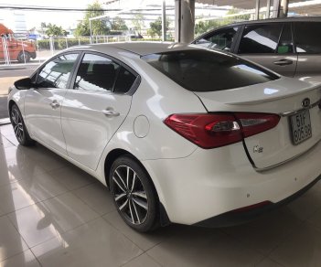 Kia K3 1.6AT 2016 - Bán Kia K3 1.6AT màu trắng, sản xuất 2016 biển Sài Gòn đi 33000km, xe đẹp