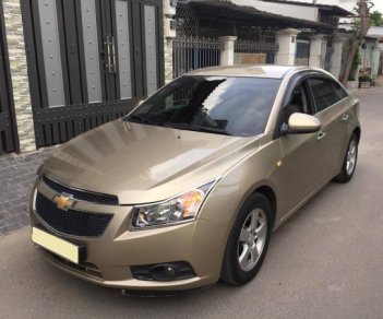 Chevrolet Cruze 2010 - Gia đình cần bán Cruze 2010, số sàn, màu vàng cát, gia đình sử dụng