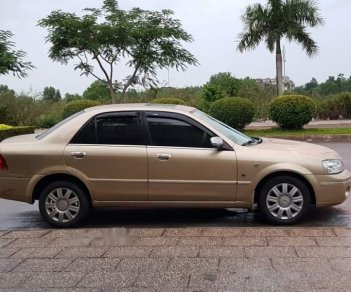 Ford Laser 1.8 AT 2003 - Bán ô tô Ford Laser 1.8 AT sản xuất 2003, màu vàng như mới