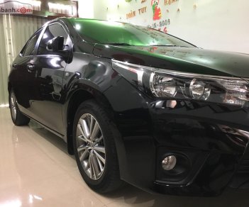 Toyota Corolla altis 1.8G AT 2015 - Bán Toyota Corolla Altis 1.8G AT đời 2015, màu đen còn mới
