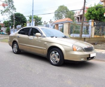 Daewoo Magnus AT 2005 - Bán Daewoo Magnus AT năm 2005, màu vàng số tự động, 148 triệu