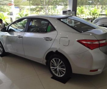 Toyota Corolla altis 1.8MT  2016 - Bán ô tô Toyota Corolla Altis 1.8MT đời 2016, màu bạc, xe như mới đi 2,1 vạn km