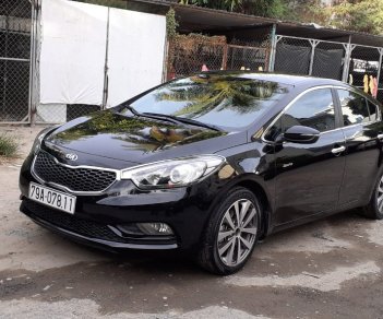 Kia K3   1.6AT 2014 - Nhu cầu đổi xe 7 chỗ nên bán Kia K3 1.6AT 2014