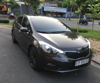 Kia K3 2.0AT 2016 - Cần bán xe Kia K3 2.0AT màu nâu 4/2016