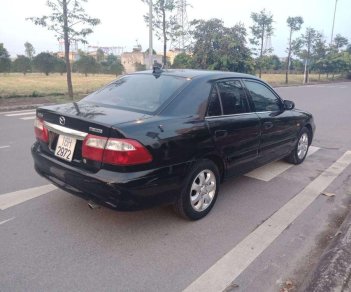 Mazda 626   2002 - Cần bán xe Mazda 626 sản xuất năm 2002, màu đen, 135tr