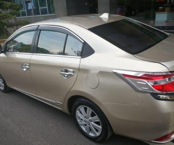 Toyota Vios 2015 - Cần bán lại xe Toyota Vios 2015, màu vàng chính chủ