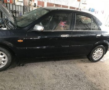 Ford Laser   2000 - Bán Ford Laser năm sản xuất 2000, màu đen, xe nhập