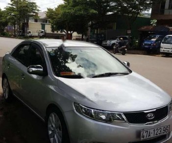 Kia Forte EX 1.6 MT 2010 - Gia đình bán Kia Forte EX 1.6 MT đời 2010, màu bạc số sàn