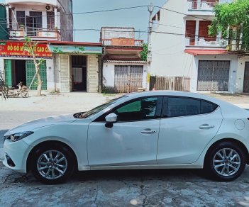 Mazda 3 1.5AT 2016 - Do nhu cầu đổi lên xe 7 chỗ cần bán xe Mazda 3 2016, màu trắng, 580 triệu