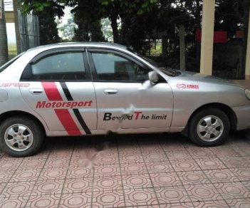 Daewoo Lanos SX 2004 - Bán ô tô Daewoo Lanos SX sản xuất năm 2004, màu bạc