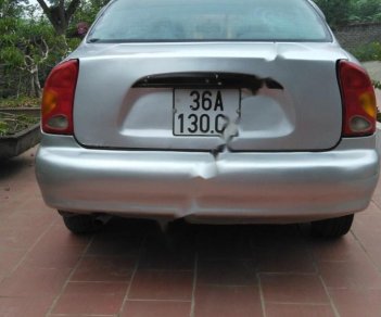 Daewoo Lanos SX 2004 - Bán ô tô Daewoo Lanos SX sản xuất năm 2004, màu bạc