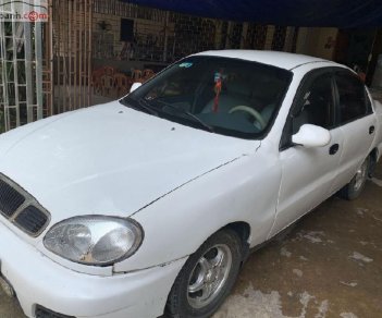 Daewoo Lanos SX 2002 - Cần bán gấp Daewoo Lanos SX đời 2002, màu trắng số sàn