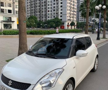 Suzuki Swift 2015 - Bán Suzuki Swift 1.4 AT đời 2015, màu trắng, xe đẹp  