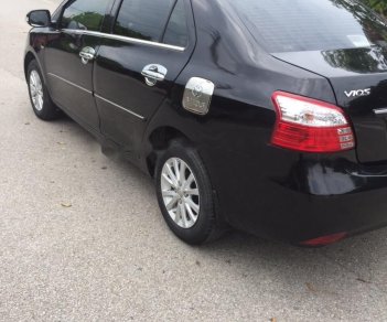 Toyota Vios 1.5 MT 2011 - Cần bán gấp Toyota Vios 1.5E năm sản xuất 2011, màu đen xe gia đình