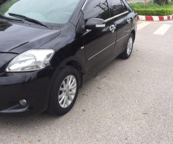 Toyota Vios 1.5 MT 2011 - Cần bán gấp Toyota Vios 1.5E năm sản xuất 2011, màu đen xe gia đình