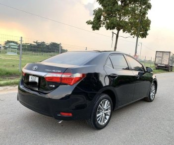 Toyota Camry  1.8GAT 2015 - Cần bán gấp Toyota Camry 1.8GAT đời 2015, màu đen