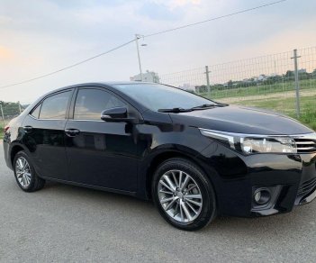 Toyota Camry  1.8GAT 2015 - Cần bán gấp Toyota Camry 1.8GAT đời 2015, màu đen