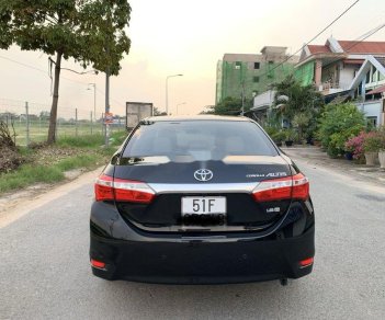 Toyota Camry  1.8GAT 2015 - Cần bán gấp Toyota Camry 1.8GAT đời 2015, màu đen