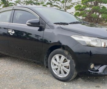 Toyota Vios 1.5E 2014 - Cần bán lại Toyota Vios E năm sản xuất 2014, màu đen, số sàn