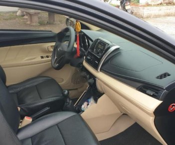 Toyota Vios 1.5E 2014 - Cần bán lại Toyota Vios E năm sản xuất 2014, màu đen, số sàn