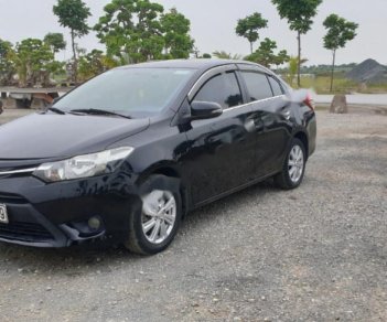 Toyota Vios 1.5E 2014 - Cần bán lại Toyota Vios E năm sản xuất 2014, màu đen, số sàn