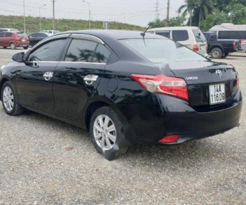 Toyota Vios 1.5E 2014 - Cần bán lại Toyota Vios E năm sản xuất 2014, màu đen, số sàn