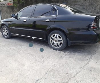 Daewoo Magnus 2.5 AT 2004 - Bán Daewoo Magnus 2.5 AT đời 2004, màu đen, giá chỉ 110 triệu