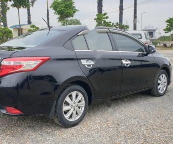 Toyota Vios 1.5E 2014 - Cần bán lại Toyota Vios E năm sản xuất 2014, màu đen, số sàn