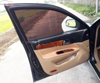 Daewoo Magnus 2.5 AT 2004 - Bán Daewoo Magnus 2.5 AT đời 2004, màu đen, giá chỉ 110 triệu