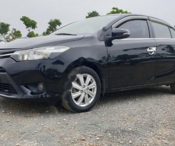 Toyota Vios 1.5E 2014 - Cần bán lại Toyota Vios E năm sản xuất 2014, màu đen, số sàn