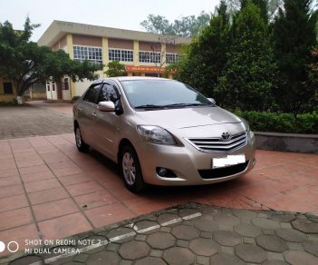 Toyota Vios 1.5E 2014 - Tôi cần bán chiếc xe ô tô Toyota Vios 1.5E màu ghi vàng SX 2014