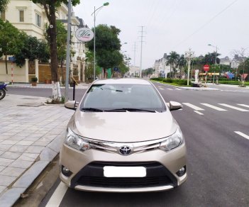 Toyota Vios 1.5E 2015 - Tôi cần bán chiếc xe ô tô Toyota Vios 1.5E màu ghi vàng, 2016