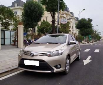 Toyota Vios 1.5E 2015 - Tôi cần bán chiếc xe ô tô Toyota Vios 1.5E màu ghi vàng, 2016