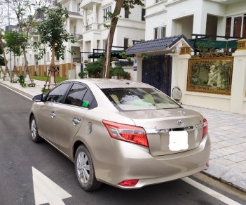 Toyota Vios 1.5E 2015 - Tôi cần bán chiếc xe ô tô Toyota Vios 1.5E màu ghi vàng, 2016