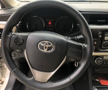 Toyota Corolla 2015 - Cần bán gấp Toyota Corolla sản xuất năm 2015, màu trắng số tự động, 570 triệu