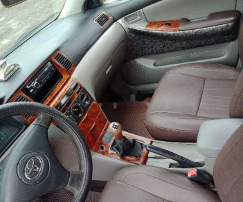 Toyota Corolla 2002 - Cần bán lại xe Toyota Corolla 1.3 sản xuất năm 2002, màu trắng xe gia đình