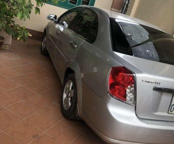 Daewoo Lacetti 2009 - Cần bán gấp Daewoo Lacetti sản xuất 2009, màu bạc