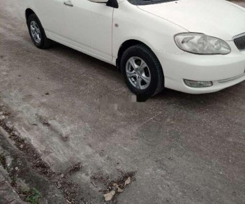 Toyota Corolla 2002 - Cần bán lại xe Toyota Corolla 1.3 sản xuất năm 2002, màu trắng xe gia đình