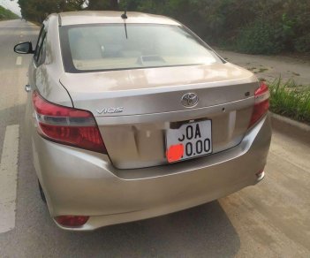 Toyota Vios 2014 - Cần bán lại xe Toyota Vios đời 2014, màu vàng cát, giá chỉ 310 triệu