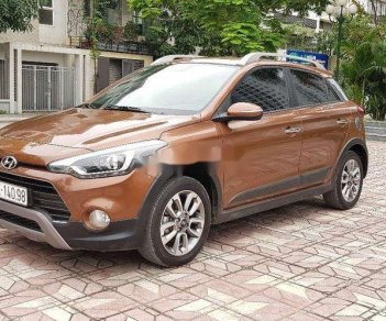 Hyundai i20 Active  1.4 AT 2015 - Cần bán gấp Hyundai i20 Active 1.4 AT 2015, màu vàng đồng, xe nhập, giá 485tr