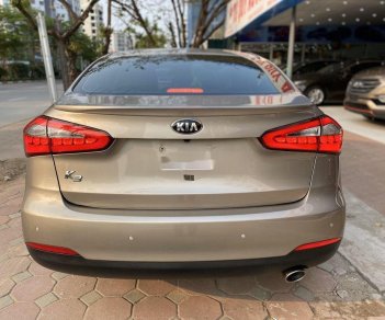 Kia K3   2015 - Cần bán xe Kia K3 1.6AT đời 2015, màu vàng cát, giá tốt