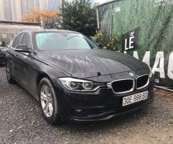 BMW 3 Series   2015 - Bán ô tô BMW 320i sản xuất 2015, màu đen, form 2016