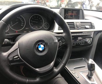 BMW 3 Series   2015 - Bán ô tô BMW 320i sản xuất 2015, màu đen, form 2016