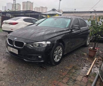 BMW 3 Series   2015 - Bán ô tô BMW 320i sản xuất 2015, màu đen, form 2016